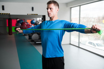 Man Warms Up With the Latex Resistance Band