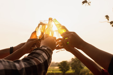 Six young entrepreneur gathering together toast for success in business start up, group party at dusk