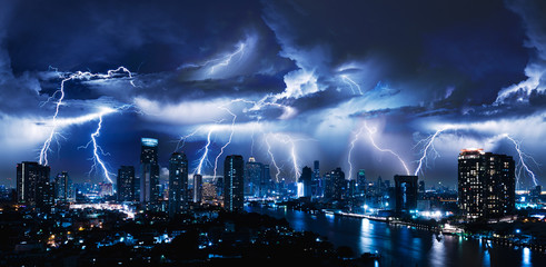 lightning storm over city in blue light