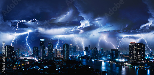 Fotografía Lightning storm over city in blue light