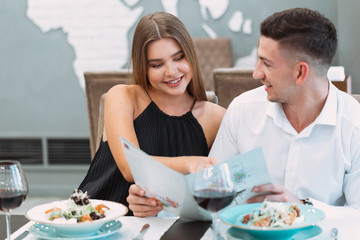 Wall Mural - Beautiful couple in a restaurant