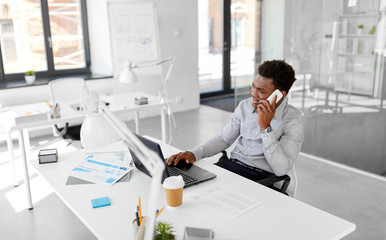 business, people, communication and technology concept - smiling african american businessman with l