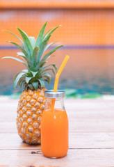 Wall Mural - Fresh yellow pineapple tropic fruit summer refreshment smoothie shake drink near pool