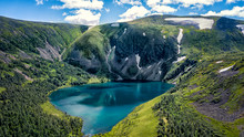 Blue Lake In The Mountains Green Grass And Snow Ivanovo Lakes