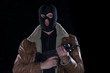 © serikbaib - man in a black mask with a gun