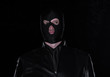 © serikbaib - a man in a black mask on a black background