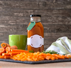 Wall Mural - nutrient organic carrot juice in bottle.