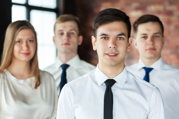 Wall Mural - Portrait of young business people looking at camera.