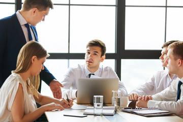 Wall Mural - Group of young business people working in office.