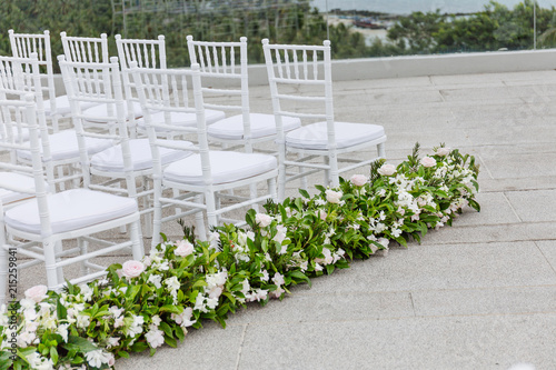 Image result for Decorate ceremony chairs with light green flowers