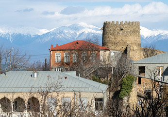 Wall Mural - Sighnaghi cityscape and Caucasus mountains, Kakheti region, Georgia