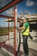 © Wavebreak Media - Engineer with level gauge working at the construction site