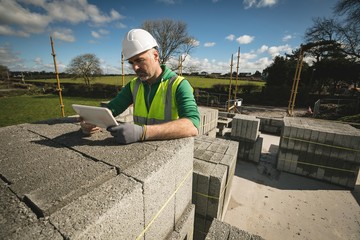 Engineer using digital tablet at the construction site