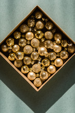 Box With Golden Small Christmas Balls
