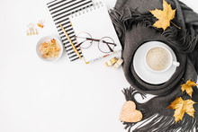 Workspace With Notebook With Empty Card, Coffee Cup Wrapped In Scarf,  Glasses. Stylish Office Desk. Autumn Or Winter Concept.  Flat Lay, Top View