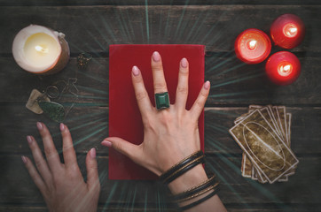 Wall Mural - Book of magic and tarot cards on fortune teller table background. Futune reading concept. Divination.