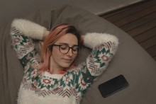 Young Woman Resting On Bean Bag