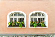 Flower Boxes Decorate Windows In Front Of A House In Passau, Germany