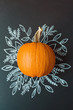 © Amy Covington/Stocksy - Pumpkin with hand drawn fall foliage