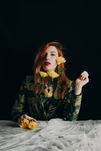Portrait Of A Cool Ginger Woman With Yellow Roses Wearing A Floral Suit