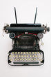 © kkgas/Stocksy - Vintage typewriter over white background
