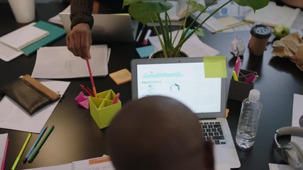 Wall Mural - slow motion diverse business people in modern boardroom working interacting planning ambitious market strategy for developing company close up