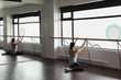 © Wavebreak Media - Young woman stretching on the barre