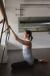 © Wavebreak Media - Young woman stretching on barre