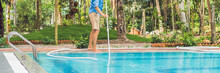 Cleaner Of The Swimming Pool . Man In A Blue Shirt With Cleaning Equipment For Swimming Pools, Sunny BANNER, Long Format
