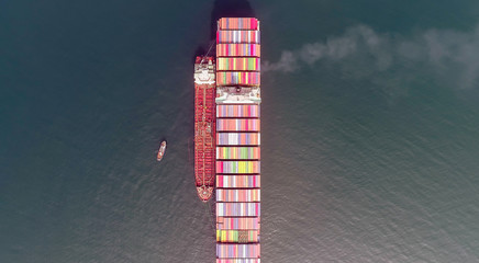 Wall Mural - Top view of a large loaded container ship and a tanker standing side by side.