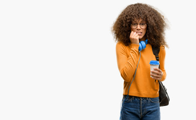 Canvas Print - African american student woman terrified and nervous expressing anxiety and panic gesture, overwhelmed