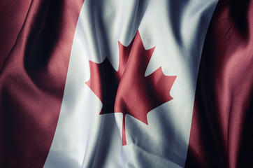 Wall Mural - Canada flag with cloth texture, retro background effect.