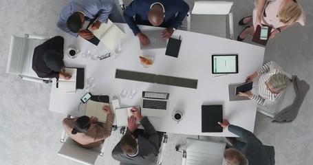 Wall Mural - time lapse diverse marketing research team brainstorming ideas on successful business solution planning strategy using colorful note paper in modern boardroom top view rotate