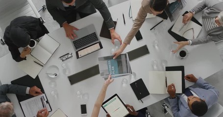 Wall Mural - professional business people meeting in boardroom diverse corporate leaders collaborating sharing ideas planning development strategy using tablet pc top view