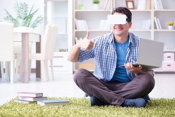 Freelance student with virtual reality glasses at home