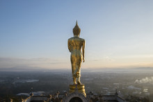 Buddha Ststue On Hill On Sunrise