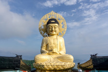 Big Golden Sitting Buddha Image Statue Over The Top Of Bohyunsa Temple In Goseong, South Korea.