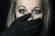© Alta Oosthuizen - Frightened blonde woman grabbed by black hands on her face artistic conversion