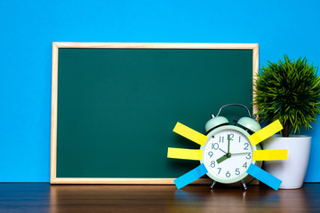 Wall Mural - Note paper sticky and vintage alarm clock and blank green chalkboard on table with copy space for add text notice something, list memo and schedule concept.