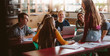 © Jacob Lund - University students chatting during break in class