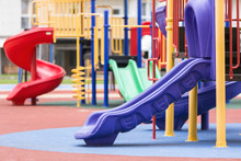 Children's Colored Slides Playground On A Street.