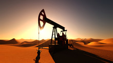 Oil Pump In Desert On Sunset
