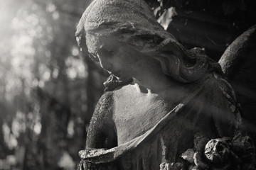  Beautiful sad angel. Vintage styled image of ancient statue. Fragment of sculpture. (religion, faith, death, resurrection, eternity concept)