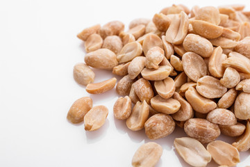 fresh peanuts on a white acrylic background