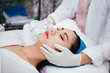 © twinsterphoto - Young Asian woman getting IPL and laser treatment by beautician at beauty clinic.