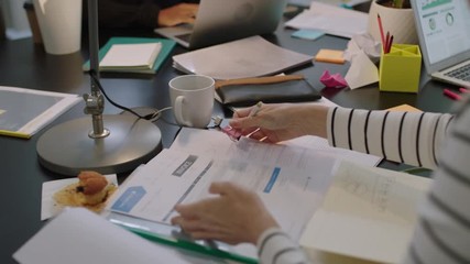 Wall Mural - close up diverse business people in modern boardroom working interacting planning ambitious market strategy for developing company