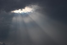 The Rays Of The Sun Through The Thick Clouds