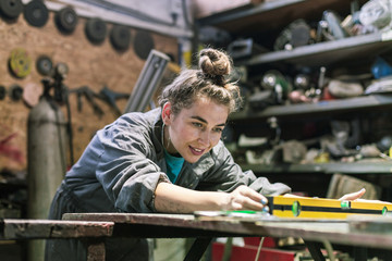 young woman working in workshop