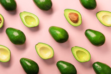Avocado Pattern On Pink Background. Top View. Banner. Pop Art Design, Creative Summer Food Concept. Green Avocadoes, Minimal Flat Lay Style.