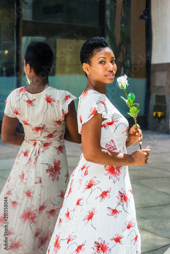 Young African American Woman With Short Afro Hair Wearing White